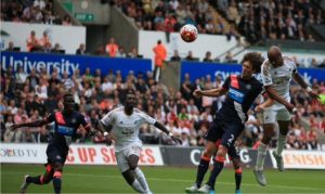 Dede Ayew rose high above Coloccini to head home his 2nd Premier League goal.