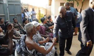 Nana Addo in a handshake with the late Samuel Nuamah's father.