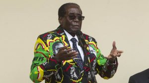 Zimbabwean President Robert Mugabe addresses people at an event before the closure of his party's 16th Annual Peoples Conference in Masvingo, about 300 kilometres south of the capital Harare, Saturday, Dec. 17, 2016. Mugabe officially opened the conference where he is set to be endorsed as the ruling party candidate for Presidential elections set for 2018.(AP Photo/Tsvangirayi Mukwazhi)