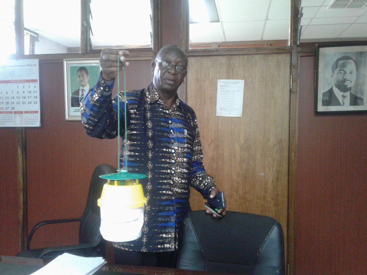 Mr Okhoba displaying a newly bought gadget for detecting pests